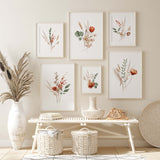 Boho flower print with greenery in orange, green and beige colors for neutral home decor.