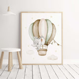 Elephant in the air with hot air balloon print for neutral nursery decor, boho nursery decor, boys room decor in sage green, brown, beige colors.