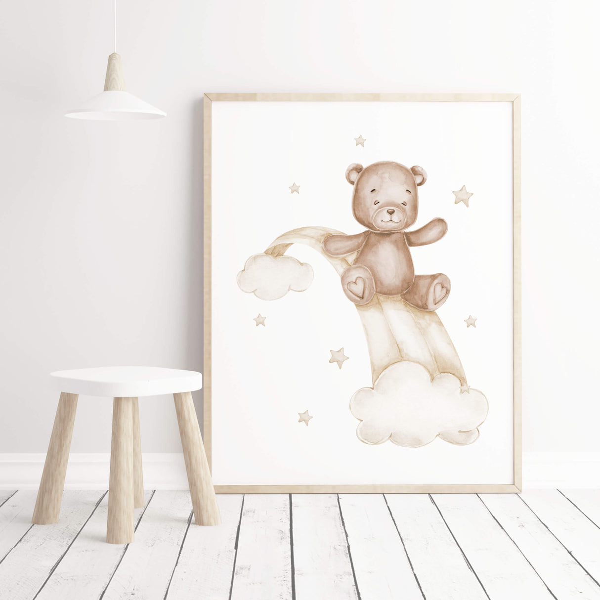 Watercolor teddy bear 
on a rainbow in beige and brown colors for gender neutral nursery ideas.