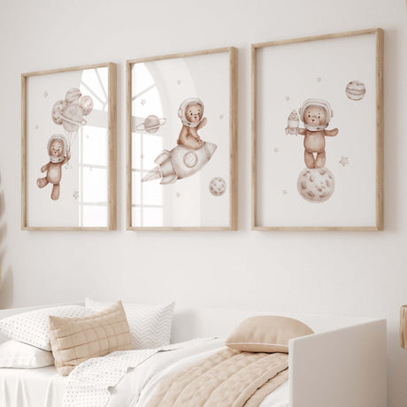 Set of 3 watercolor astronaut teddy bear in space print with beige and brown colors for gender neutral nursery decor.