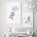 Set of 2 watercolor astronaut teddy bear in space poster with light blue and brown colors for toddler room decor and baby boys room decor.